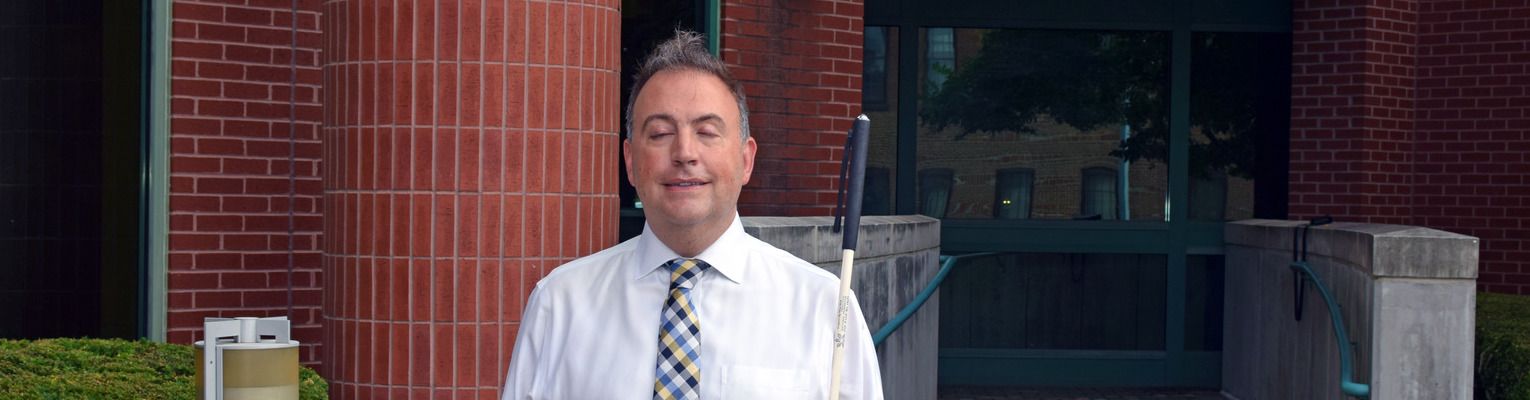 President Riccobono stands in front of the NFB Headquarters